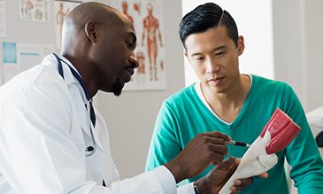 Doctor speaking with man